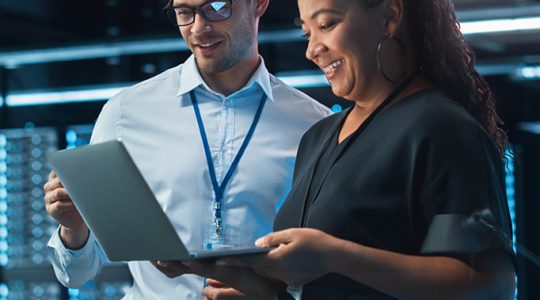 Two analysts reading a report